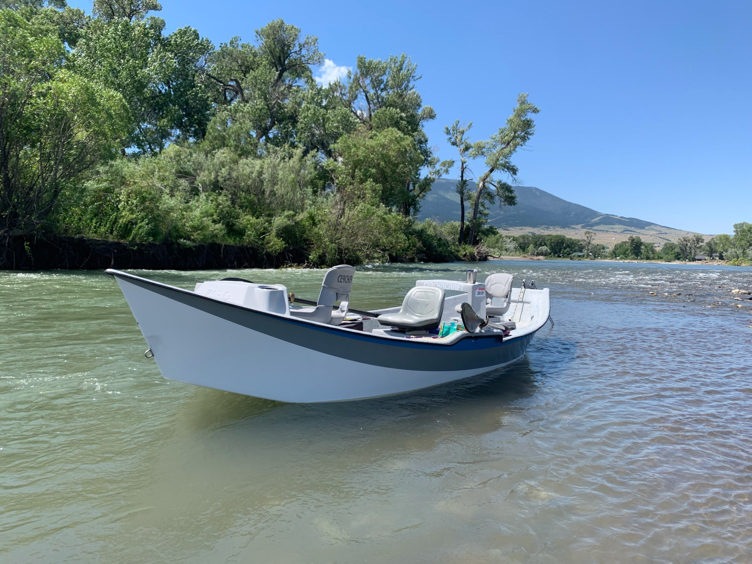 drift boat in beautiful water